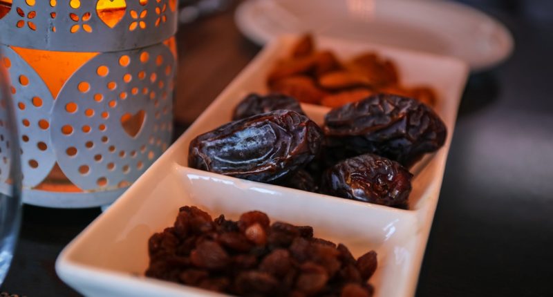 close up photo of raisins and dates