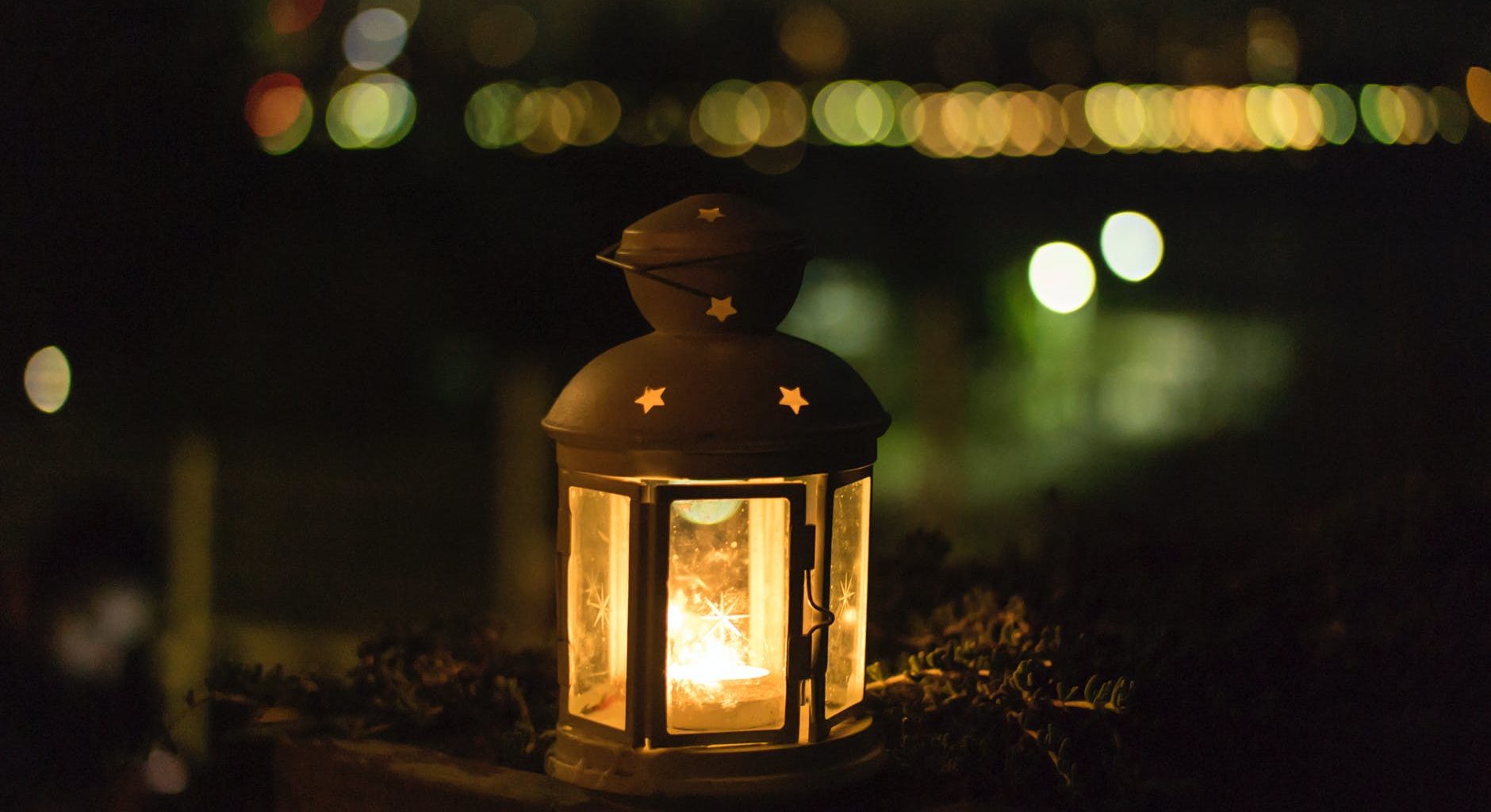 photo of yellow lantern during night