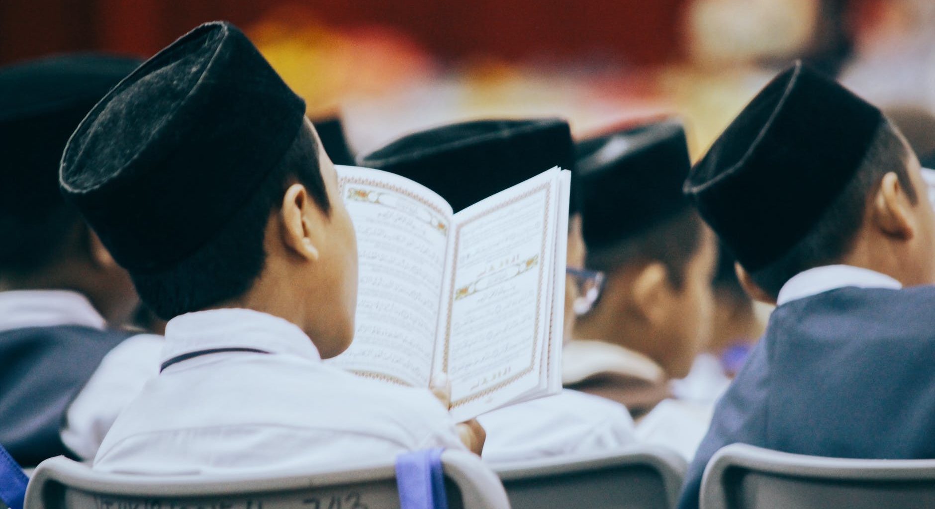 photo of person reading quran