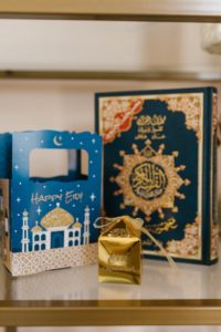 blue and gold book on white table